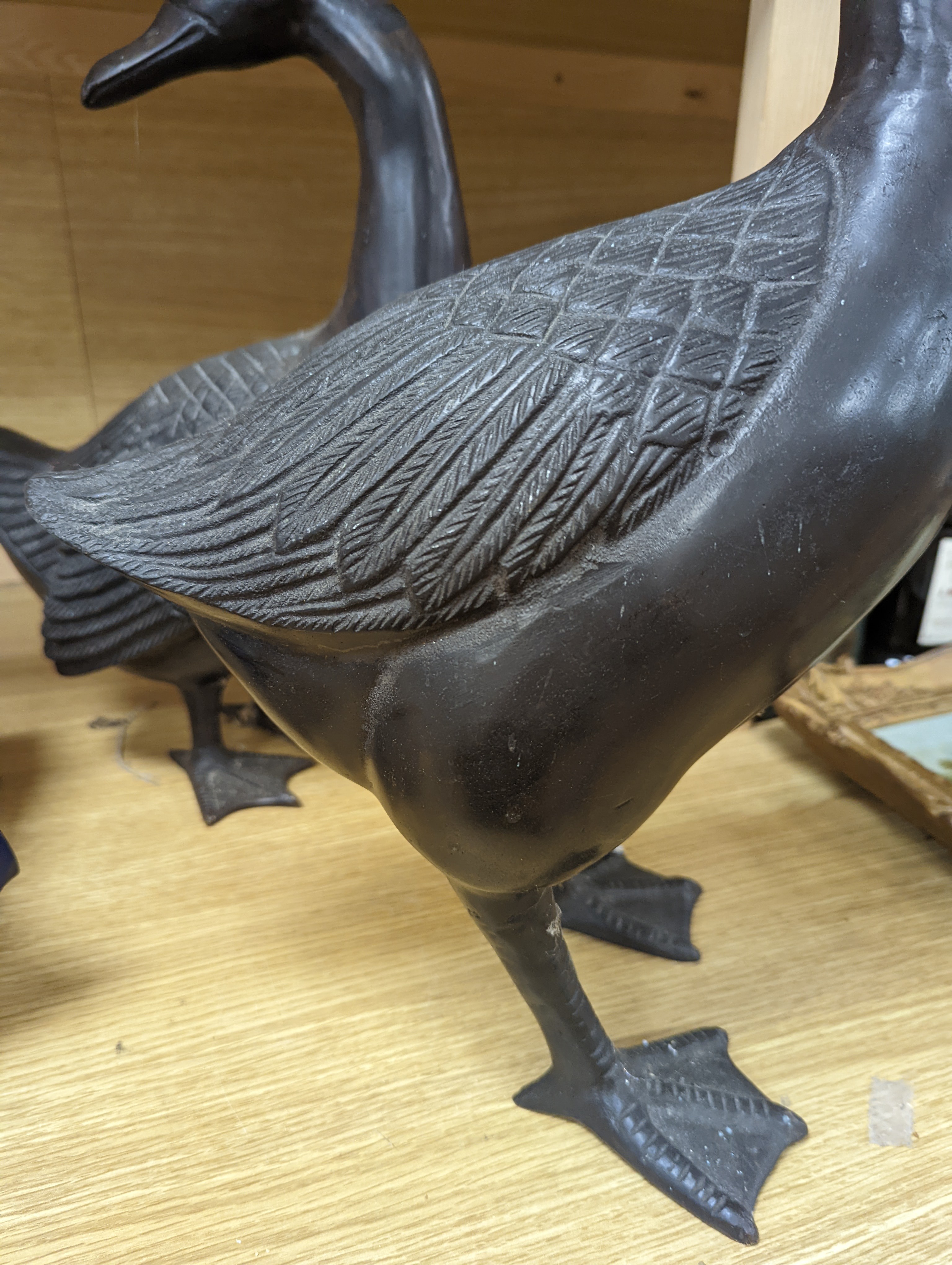A pair of modern Chinese bronze models of geese, largest 48cm